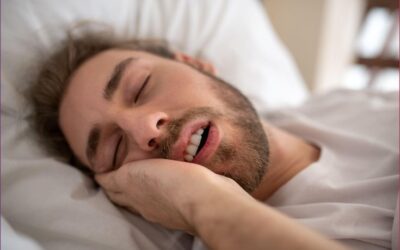 Person snoring due to summer heat and humidity affecting breathing during sleep