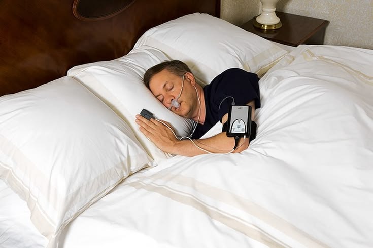 Sleep apnea patient waking up gasping for air at night due to airway collapse and snoring while sleeping on his back